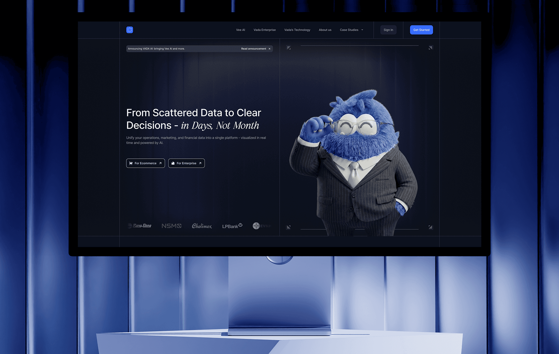 The Vadata website on a monitor in a blue studio